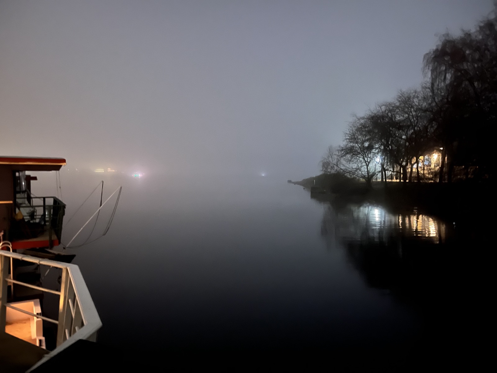 Houseboat in winter fog